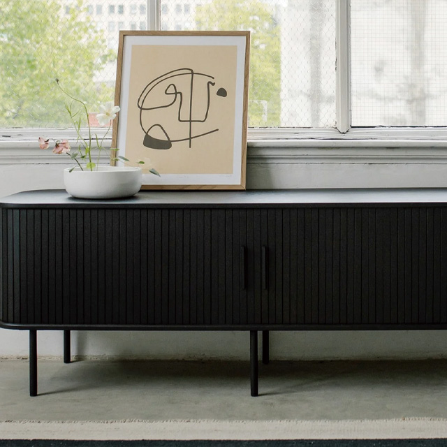French roll-up doors blend TV cabinet